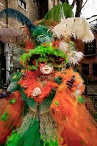 The parade of people in costume at the 2026 Venice Carnival in front of the Church of San Zaccaria.