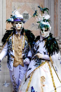 The parade of people in costume at the 2026 Venice Carnival in front of the Church of San Zaccaria.