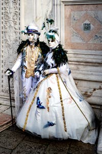 The parade of people in costume at the 2026 Venice Carnival in front of the Church of San Zaccaria.