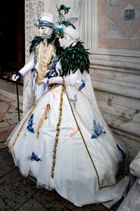 The parade of people in costume at the 2026 Venice Carnival in front of the Church of San Zaccaria.
