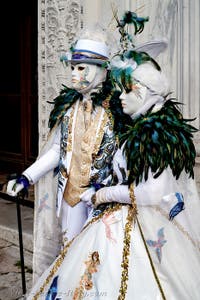 The parade of people in costume at the 2026 Venice Carnival in front of the Church of San Zaccaria.