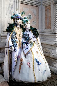 The parade of people in costume at the 2026 Venice Carnival in front of the Church of San Zaccaria.