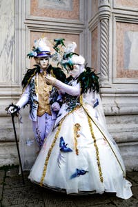 The parade of people in costume at the 2026 Venice Carnival in front of the Church of San Zaccaria.