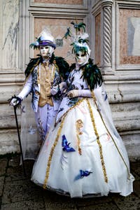 The parade of people in costume at the 2026 Venice Carnival in front of the Church of San Zaccaria.