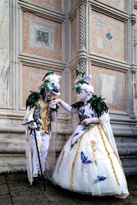 The parade of people in costume at the 2026 Venice Carnival in front of the Church of San Zaccaria.