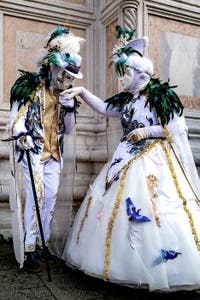 The parade of people in costume at the 2026 Venice Carnival in front of the Church of San Zaccaria.