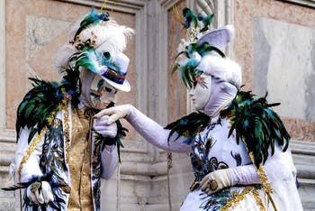 Venice carnival costumed figures