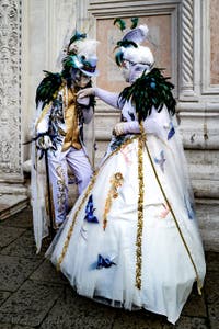 The parade of people in costume at the 2026 Venice Carnival in front of the Church of San Zaccaria.