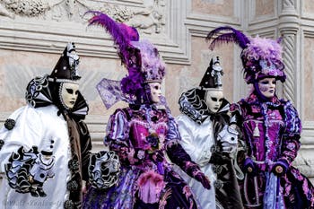 The parade of people in costume at the 2026 Venice Carnival in front of the Church of San Zaccaria.