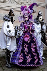 The parade of people in costume at the 2026 Venice Carnival in front of the Church of San Zaccaria.