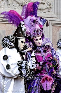 The parade of people in costume at the 2026 Venice Carnival in front of the Church of San Zaccaria.
