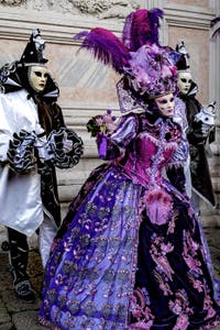 The parade of people in costume at the 2026 Venice Carnival in front of the Church of San Zaccaria.