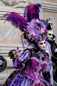 The parade of people in costume at the 2026 Venice Carnival in front of the Church of San Zaccaria.