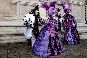 The parade of people in costume at the 2026 Venice Carnival in front of the Church of San Zaccaria.