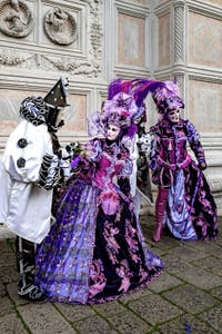 The parade of people in costume at the 2026 Venice Carnival in front of the Church of San Zaccaria.