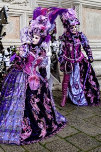 The parade of people in costume at the 2026 Venice Carnival in front of the Church of San Zaccaria.