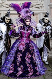 The parade of people in costume at the 2026 Venice Carnival in front of the Church of San Zaccaria.