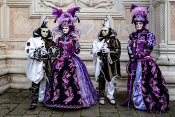 The parade of people in costume at the 2026 Venice Carnival in front of the Church of San Zaccaria.