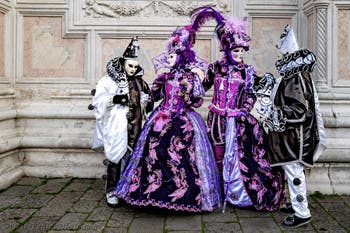 The parade of people in costume at the 2026 Venice Carnival in front of the Church of San Zaccaria.