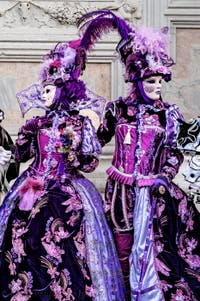 The parade of people in costume at the 2026 Venice Carnival in front of the Church of San Zaccaria.