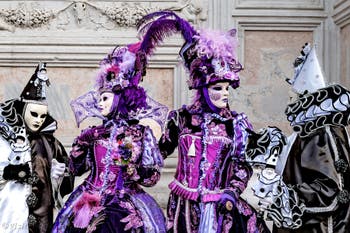Venice carnival costumed figures
