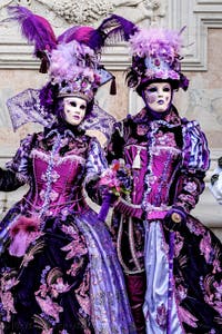 The parade of people in costume at the 2026 Venice Carnival in front of the Church of San Zaccaria.