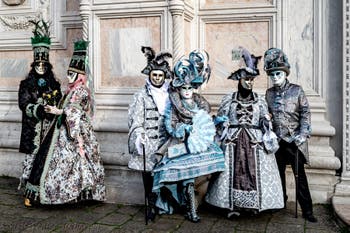The parade of people in costume at the 2026 Venice Carnival in front of the Church of San Zaccaria.