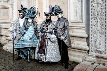 The parade of people in costume at the 2026 Venice Carnival in front of the Church of San Zaccaria.
