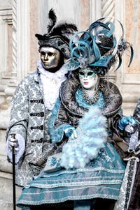The parade of people in costume at the 2026 Venice Carnival in front of the Church of San Zaccaria.