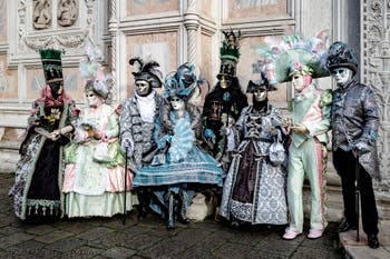 The parade of people in costume at the 2026 Venice Carnival in front of the Church of San Zaccaria.