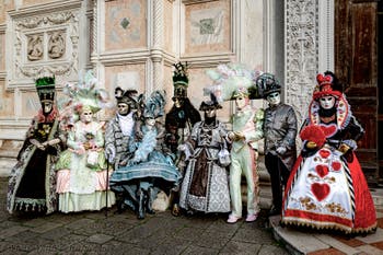 The parade of people in costume at the 2026 Venice Carnival in front of the Church of San Zaccaria.