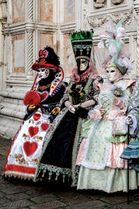 The parade of people in costume at the 2026 Venice Carnival in front of the Church of San Zaccaria.