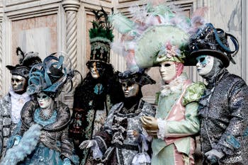 The parade of people in costume at the 2026 Venice Carnival in front of the Church of San Zaccaria.