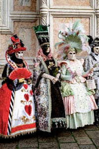 The parade of people in costume at the 2026 Venice Carnival in front of the Church of San Zaccaria.
