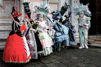 The parade of people in costume at the 2026 Venice Carnival in front of the Church of San Zaccaria.