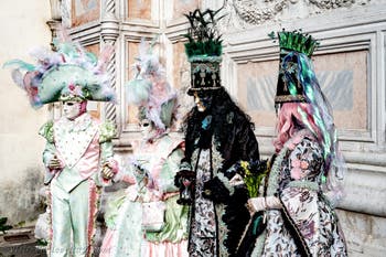 The parade of people in costume at the 2026 Venice Carnival in front of the Church of San Zaccaria.