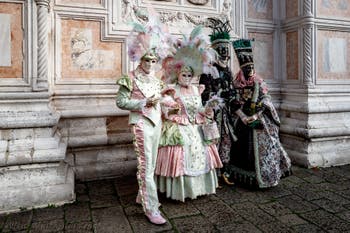 The parade of people in costume at the 2026 Venice Carnival in front of the Church of San Zaccaria.