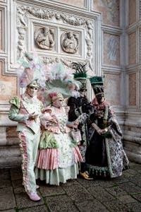The parade of people in costume at the 2026 Venice Carnival in front of the Church of San Zaccaria.