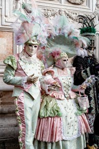 The parade of people in costume at the 2026 Venice Carnival in front of the Church of San Zaccaria.