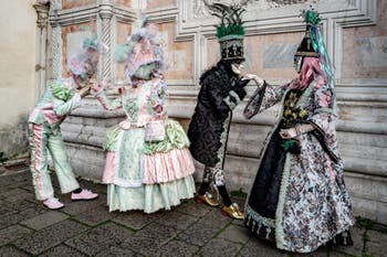 Venice carnival costumed figures