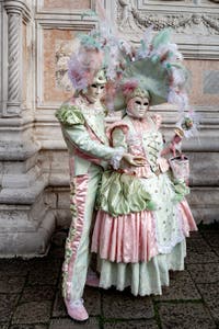 The parade of people in costume at the 2026 Venice Carnival in front of the Church of San Zaccaria.