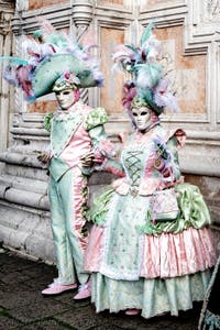 The parade of people in costume at the 2026 Venice Carnival in front of the Church of San Zaccaria.