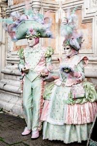 The parade of people in costume at the 2026 Venice Carnival in front of the Church of San Zaccaria.