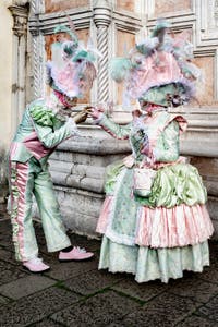 The parade of people in costume at the 2026 Venice Carnival in front of the Church of San Zaccaria.