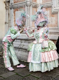The parade of people in costume at the 2026 Venice Carnival in front of the Church of San Zaccaria.