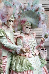 The parade of people in costume at the 2026 Venice Carnival in front of the Church of San Zaccaria.