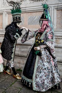 The parade of people in costume at the 2026 Venice Carnival in front of the Church of San Zaccaria.