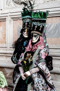 The parade of people in costume at the 2026 Venice Carnival in front of the Church of San Zaccaria.