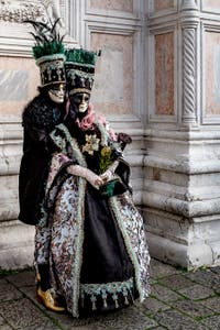 The parade of people in costume at the 2026 Venice Carnival in front of the Church of San Zaccaria.