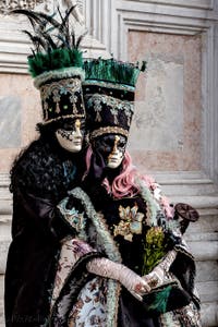 The parade of people in costume at the 2026 Venice Carnival in front of the Church of San Zaccaria.